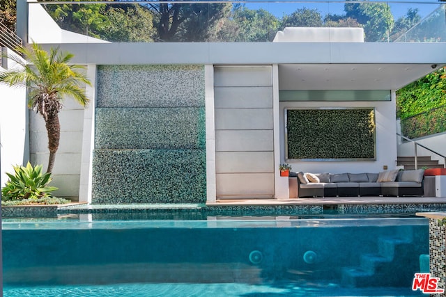 view of pool with outdoor lounge area