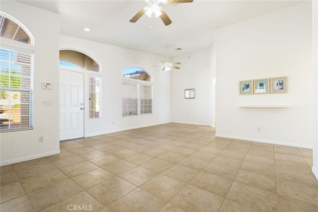 entrance foyer featuring ceiling fan and light tile patterned flooring