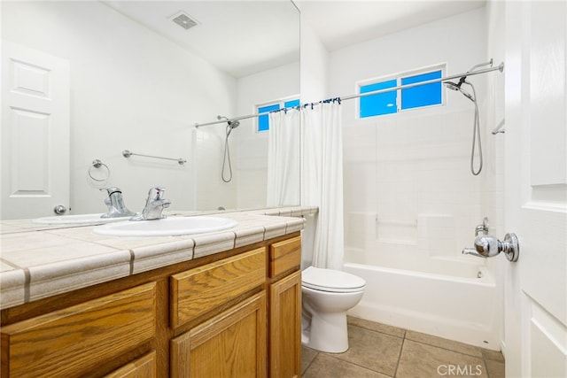 full bathroom featuring tile patterned flooring, vanity, shower / bath combo, and toilet