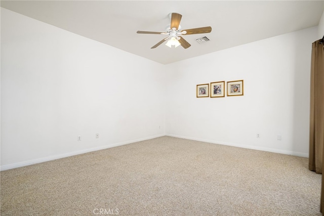 empty room with carpet and ceiling fan