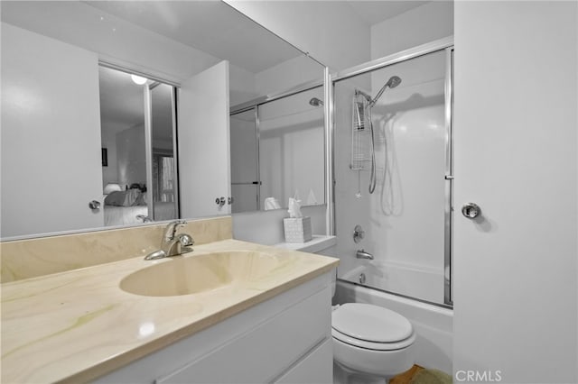 full bathroom with vanity, toilet, and enclosed tub / shower combo