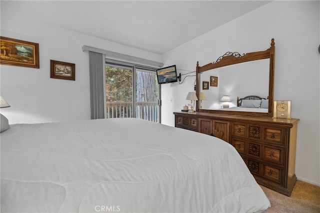 carpeted bedroom featuring access to outside