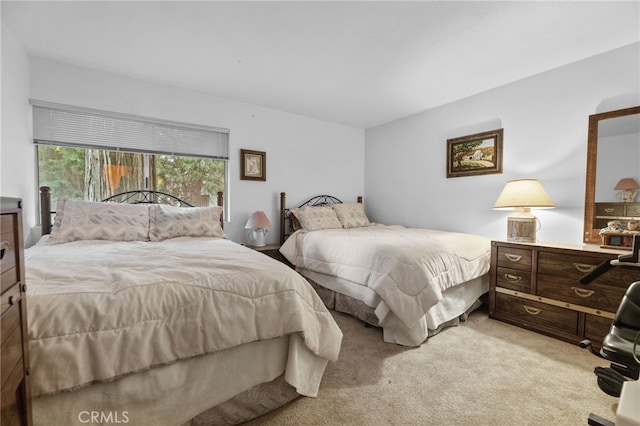 bedroom with light colored carpet