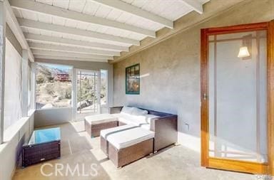 sunroom with beam ceiling