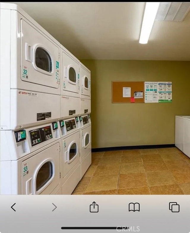 clothes washing area featuring washing machine and dryer and stacked washer and dryer