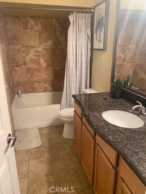 full bathroom featuring shower / bath combination with curtain, toilet, and vanity