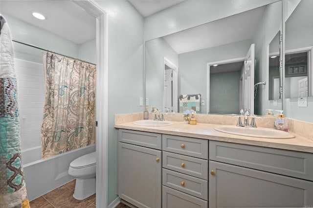 full bathroom with shower / bathtub combination with curtain, tile patterned flooring, vanity, and toilet