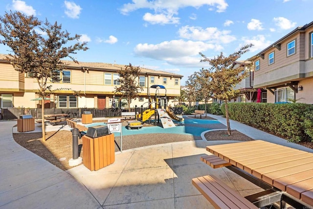 view of pool featuring a playground