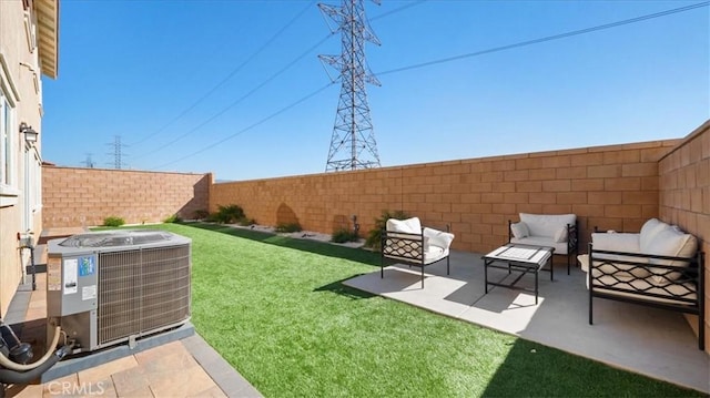 view of yard with outdoor lounge area, a patio, and central AC