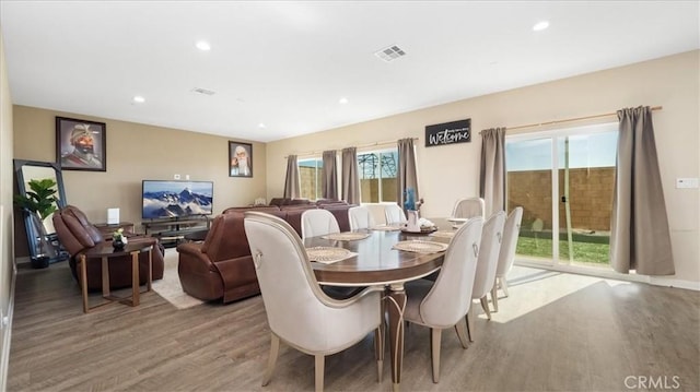 dining space with light hardwood / wood-style floors