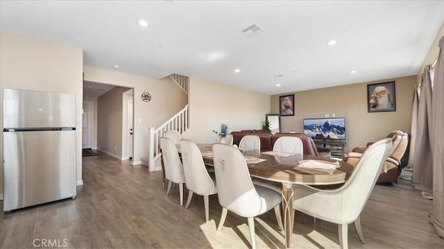 dining space featuring hardwood / wood-style flooring