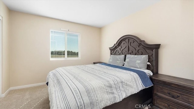 bedroom with light colored carpet