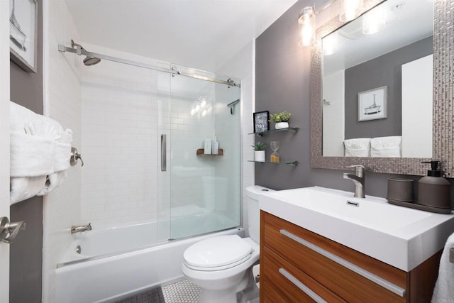 full bathroom with tile patterned flooring, vanity, toilet, and shower / bath combination with glass door