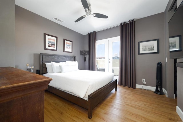 bedroom with ceiling fan, light wood-type flooring, and connected bathroom