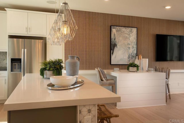 dining room featuring a chandelier and light hardwood / wood-style floors