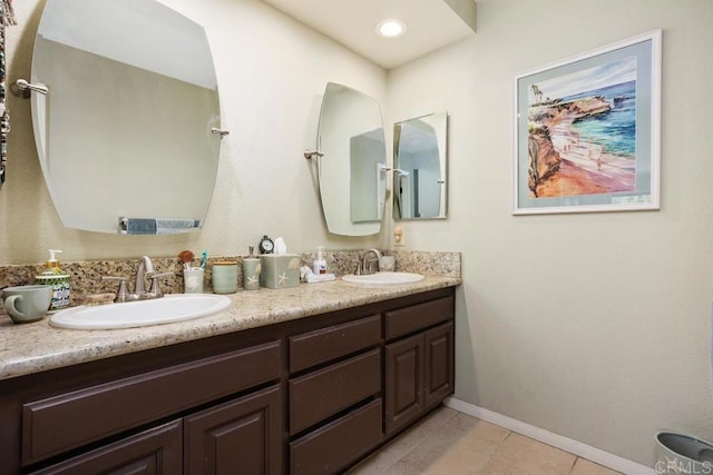 bathroom with tile patterned flooring and vanity