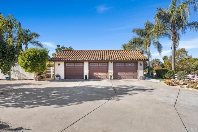 view of front of house featuring a garage and an outdoor structure