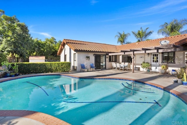 view of pool with a pergola and a patio area