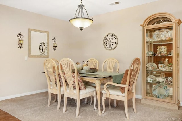 dining space featuring carpet flooring