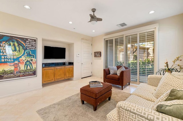 tiled living room featuring ceiling fan