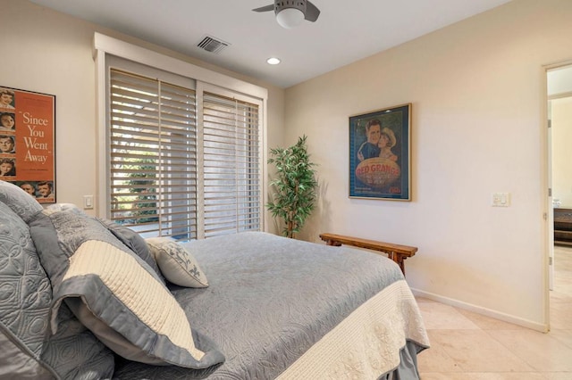 tiled bedroom with ceiling fan