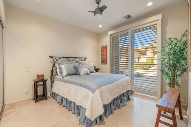 tiled bedroom featuring ceiling fan