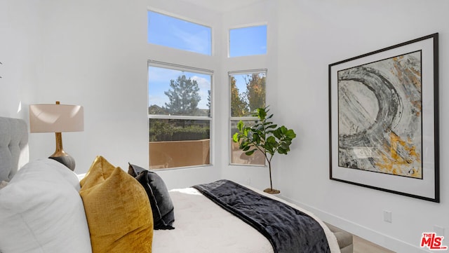 bedroom with hardwood / wood-style flooring