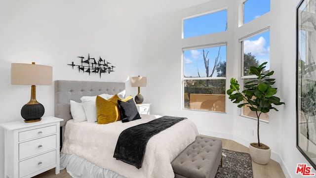 bedroom with light wood-type flooring