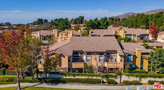 birds eye view of property featuring a mountain view