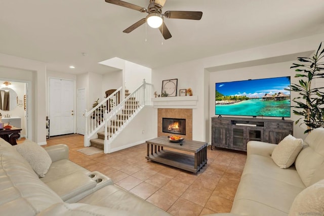 living room with ceiling fan and light tile patterned flooring