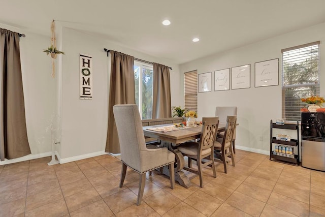 tiled dining room featuring a wealth of natural light