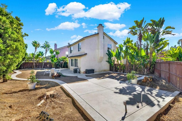 back of house featuring a patio