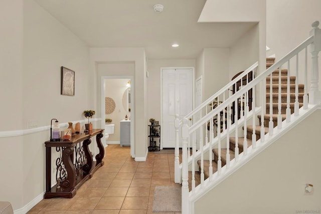 entrance foyer with light tile patterned floors