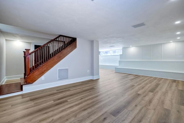 unfurnished living room with light hardwood / wood-style flooring