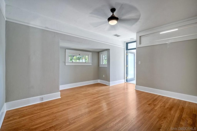 unfurnished room featuring ceiling fan and light hardwood / wood-style flooring