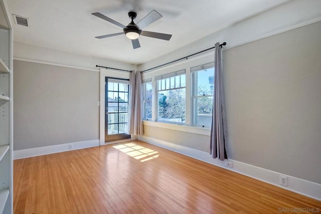 empty room with light hardwood / wood-style floors and ceiling fan