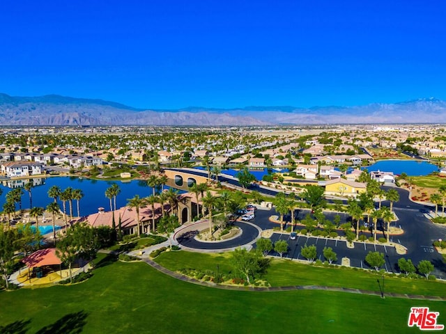 birds eye view of property featuring a water and mountain view