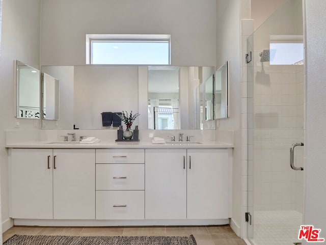 bathroom featuring vanity and walk in shower