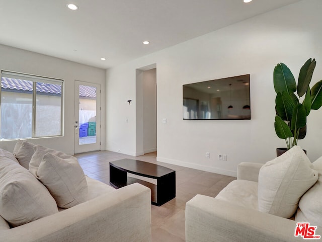 living room with light tile patterned flooring