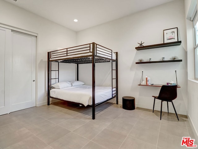 unfurnished bedroom with light tile patterned floors