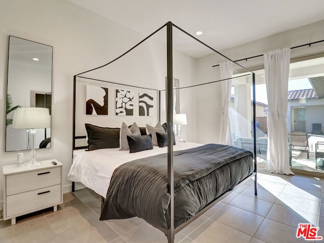 tiled bedroom featuring access to outside