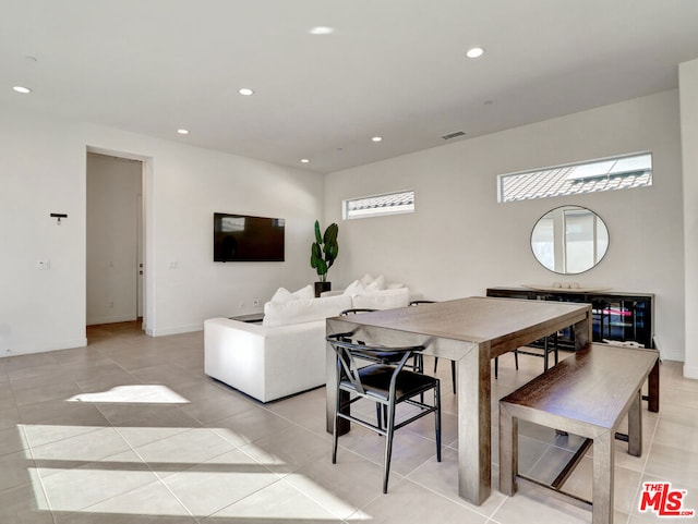 dining area with light tile patterned floors