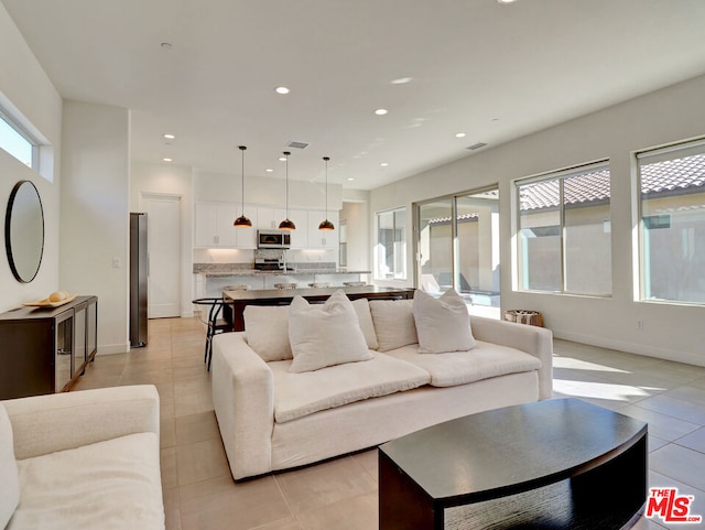 living room with light tile patterned flooring