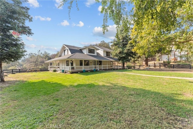 country-style home with a front lawn and covered porch