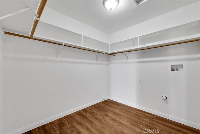 spacious closet featuring hardwood / wood-style floors