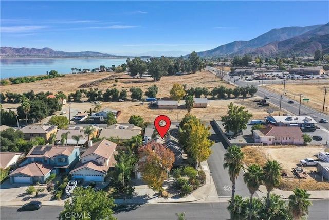 bird's eye view featuring a water and mountain view