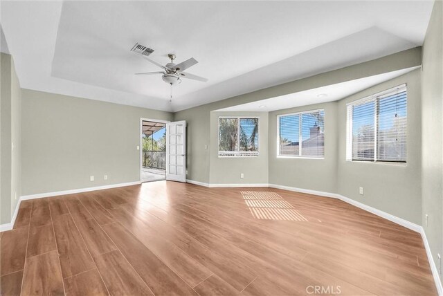 spare room featuring light hardwood / wood-style flooring and ceiling fan