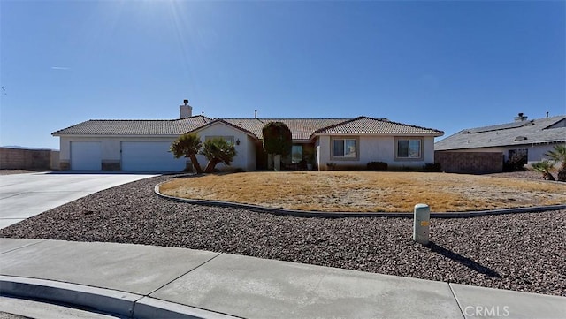 ranch-style house featuring a garage