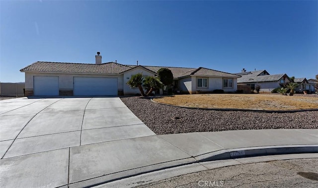 single story home featuring a garage