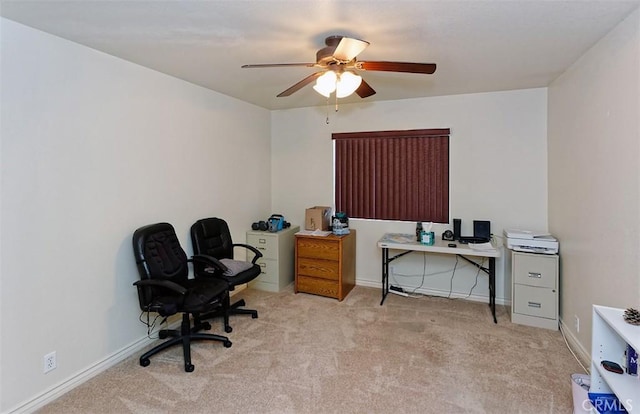 carpeted home office with ceiling fan